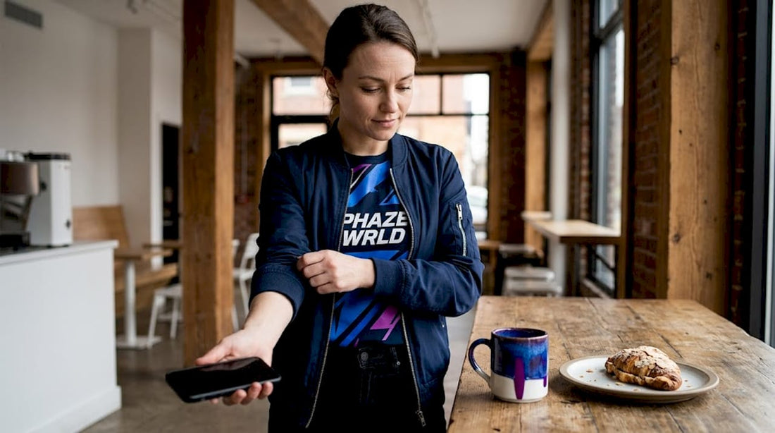 Woman styling graphic tee under sweater