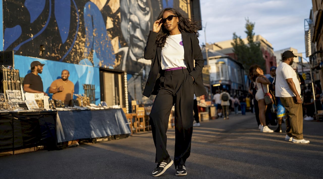 Young woman wearing styled graphic tee on rooftop