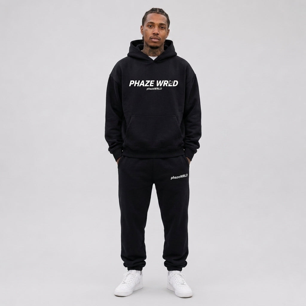 Black oversized heavyweight streetwear hoodie with a white Phaze Wrld planet graphic on the chest.