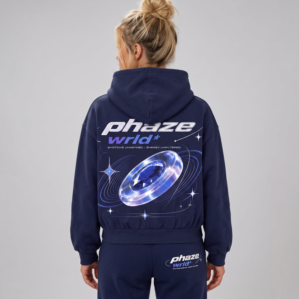 Model wearing the navy Blue Frequency hoodie from the back, showing the large futuristic 'phaze wrld*' graphic.