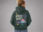 Model wearing the back of the dark green Lost in Space hoodie, showing the large colorful celestial landscape graphic.
