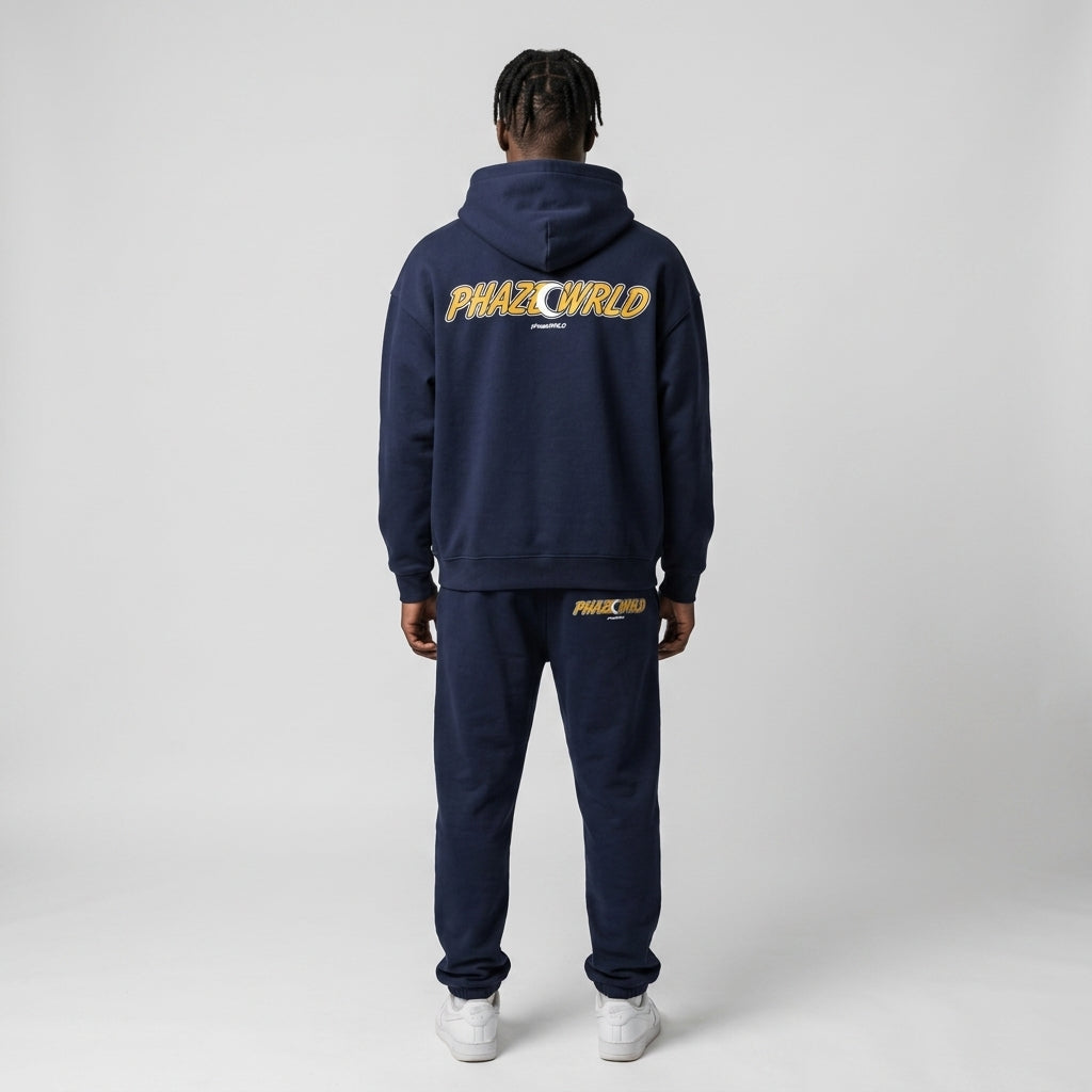 Back view of a premium navy blue oversized streetwear hoodie featuring a yellow and white PHAZEWRLD crescent moon graphic on the back.