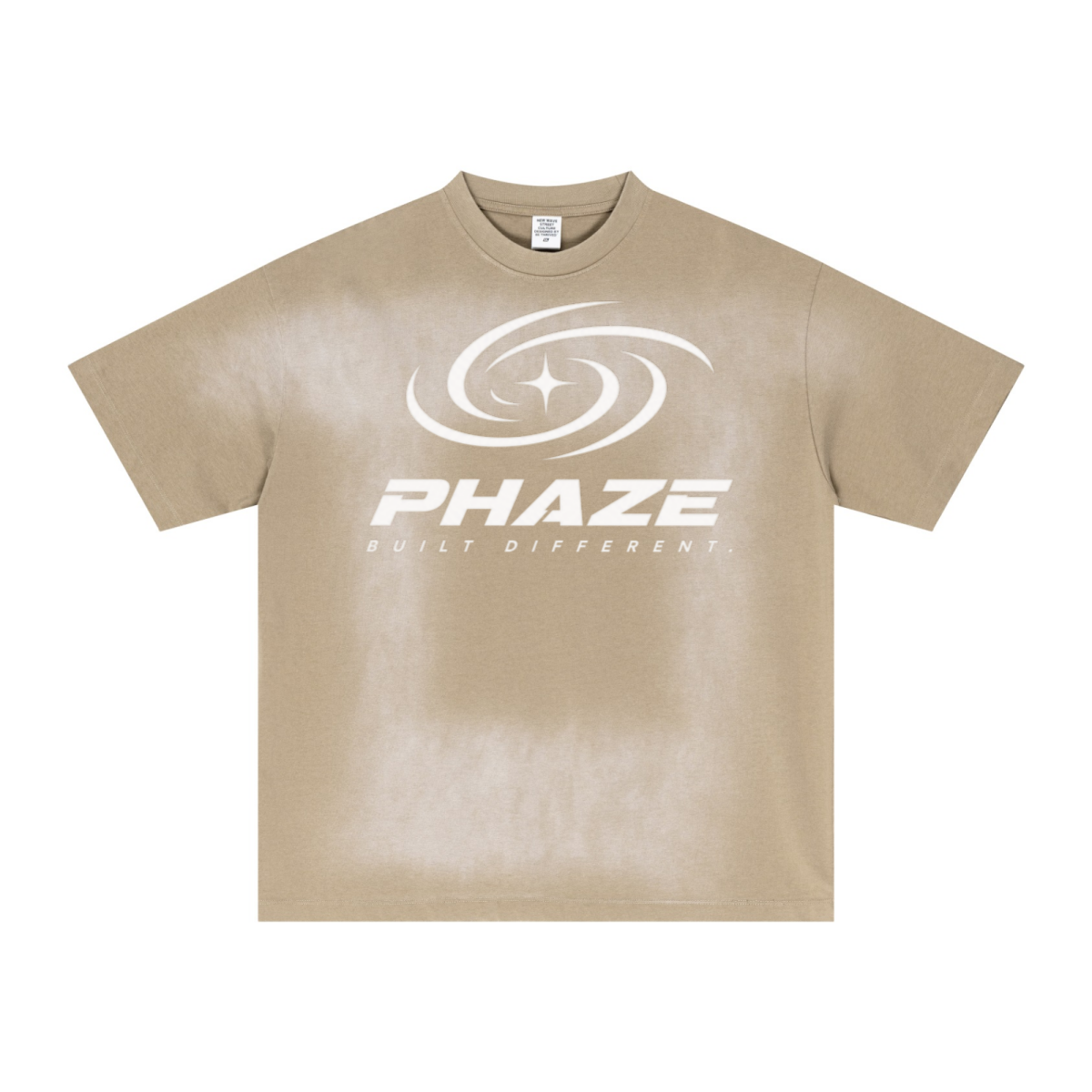 Cream streetwear oversized t-shirt featuring a futuristic silver PHAZE swirl graphic and "Built Different" text. Heavyweight cotton boxy fit.
