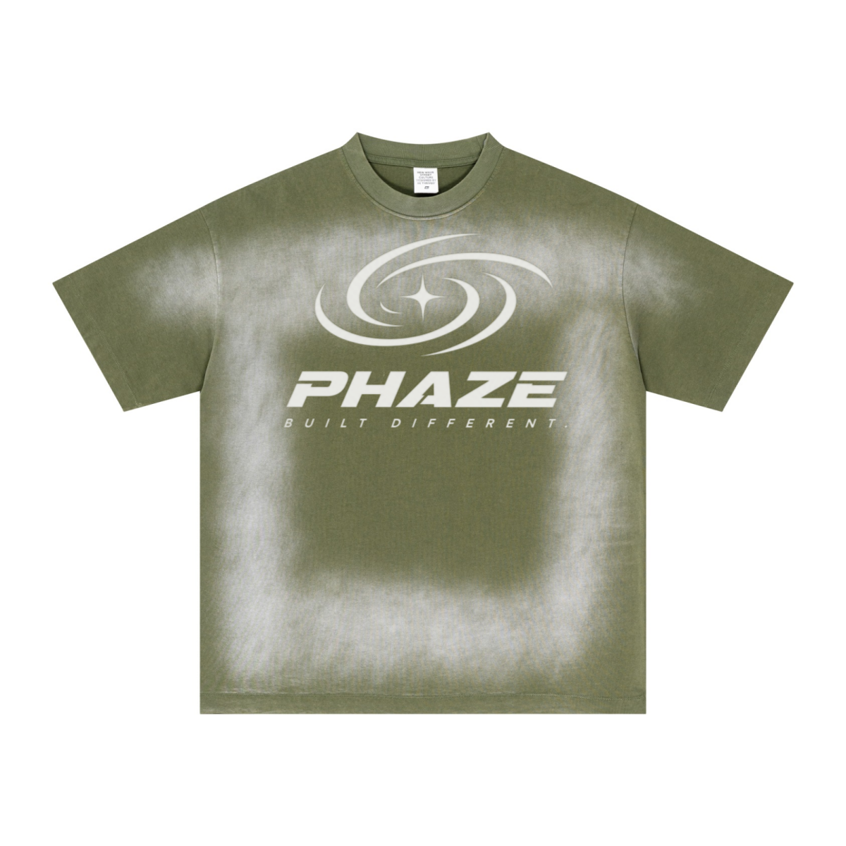 Military green streetwear oversized t-shirt featuring a futuristic silver PHAZE swirl graphic and "Built Different" text. Heavyweight cotton boxy fit.