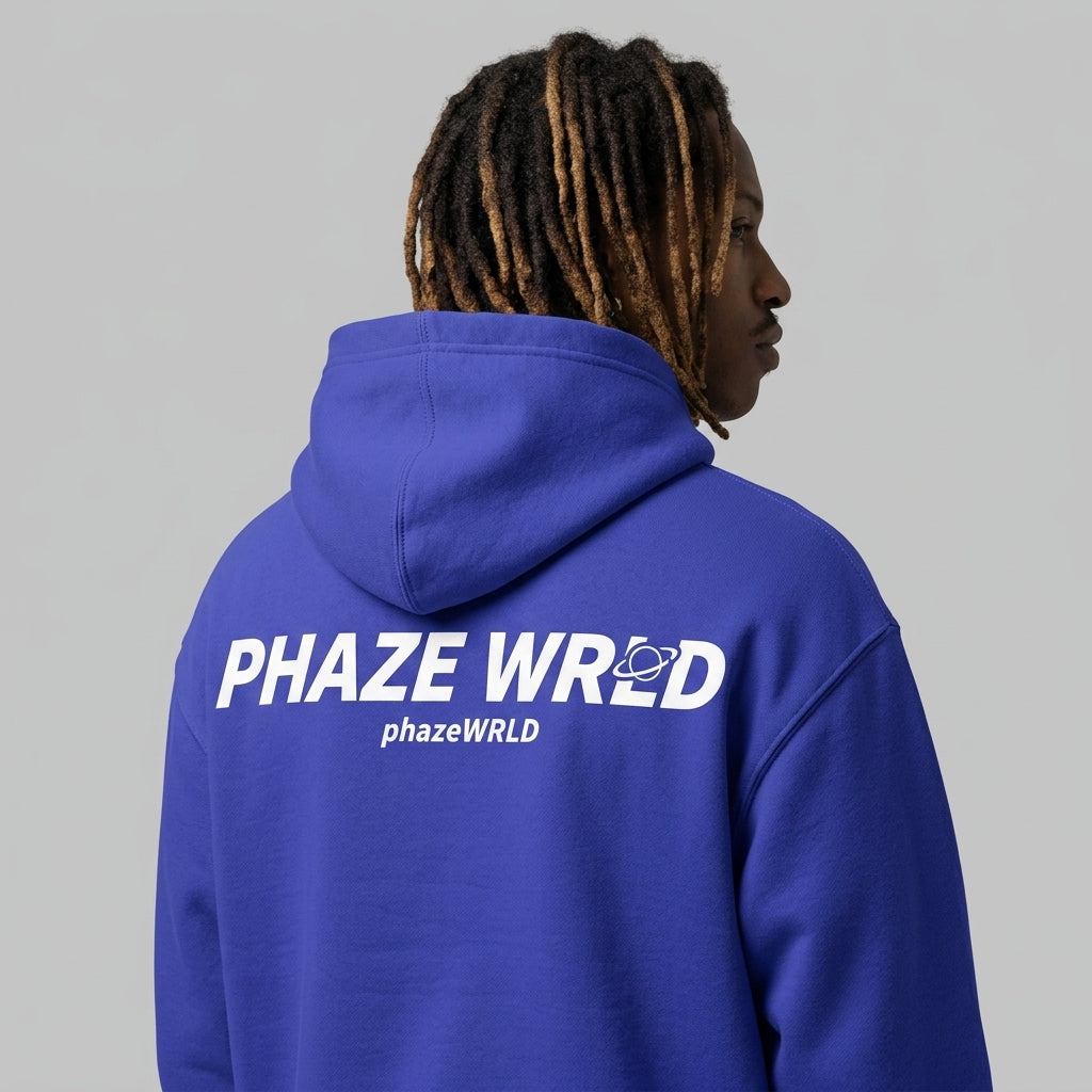 Back view of a premium royal blue oversized streetwear hoodie featuring a bold white Phaze Wrld graphic with a planet icon.