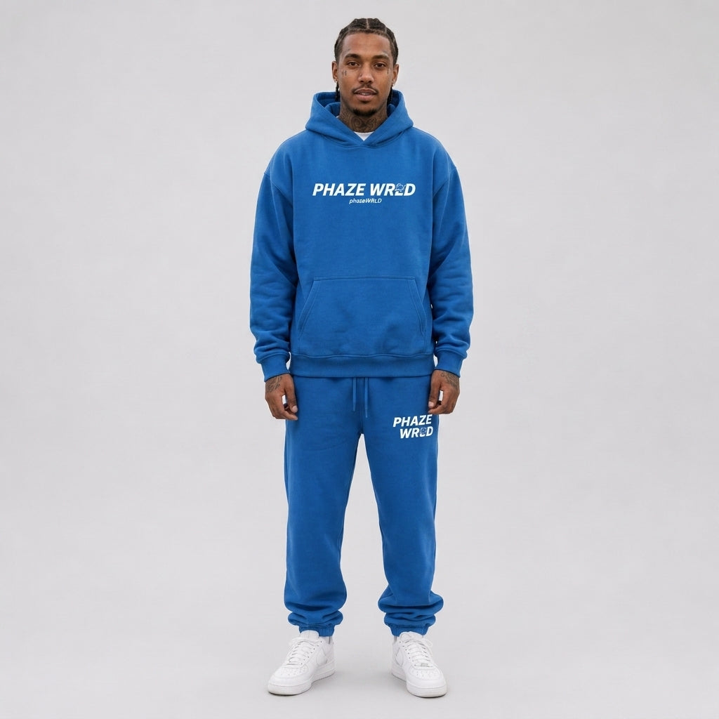 A premium royal blue oversized streetwear hoodie featuring a white Phaze Wrld graphic logo on the chest with a kangaroo pocket.