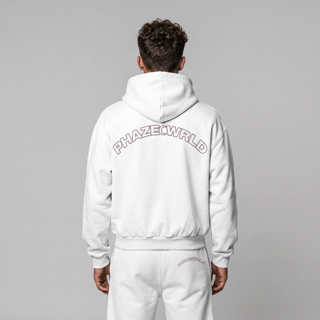 Rear view of a premium white oversized streetwear hoodie featuring a dusty purple arched PHAZECWRLD outline graphic on the back.