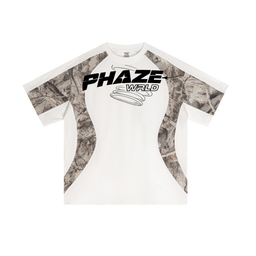 Oversized white Y2K & Streetwear tee featuring realtree camo curved paneling and a bold black PHAZE WRLD futuristic chest graphic.